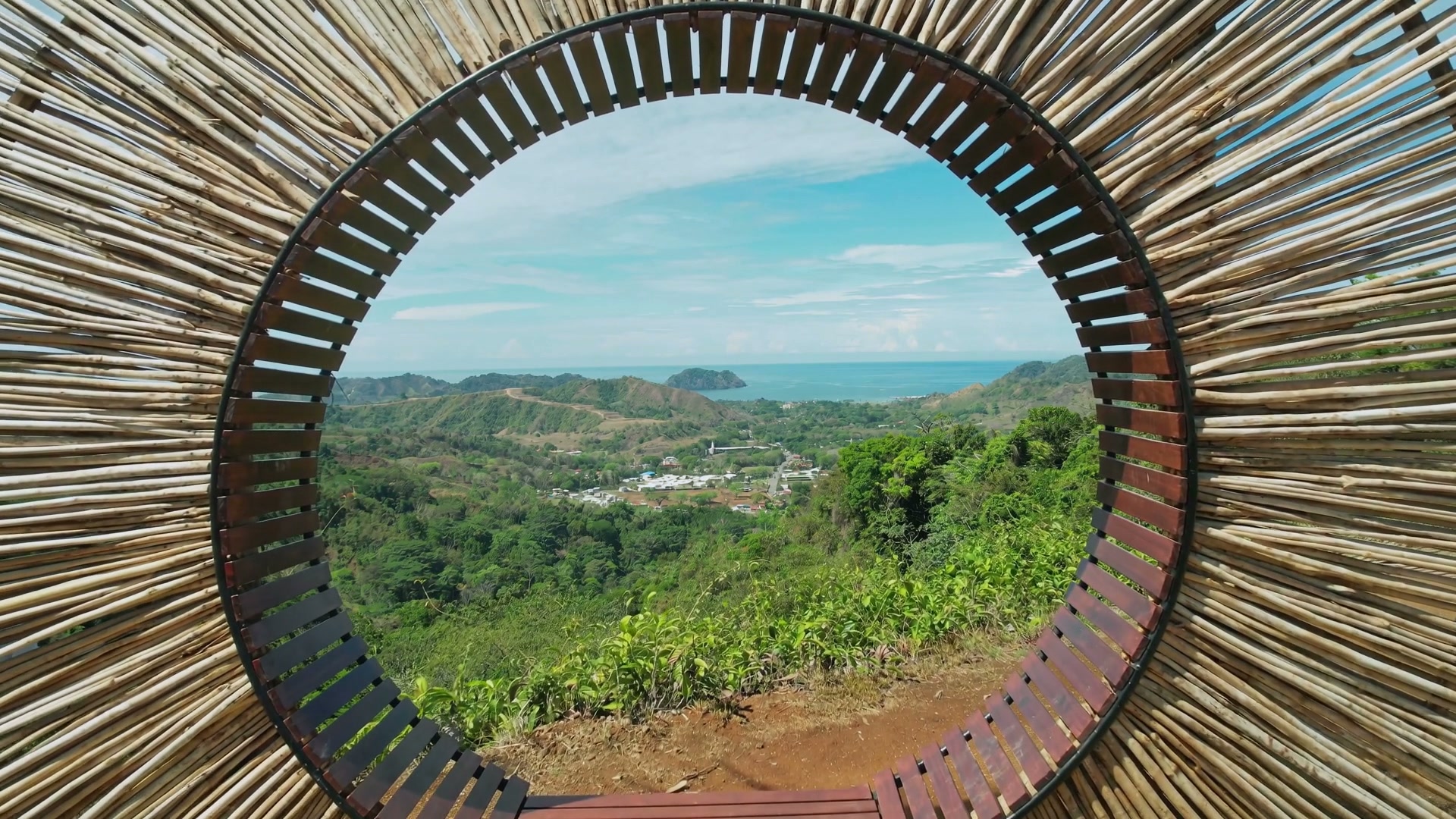 Aerial view of Herradura Bay and the rainforest above Vista Los Sueños Adventure Park